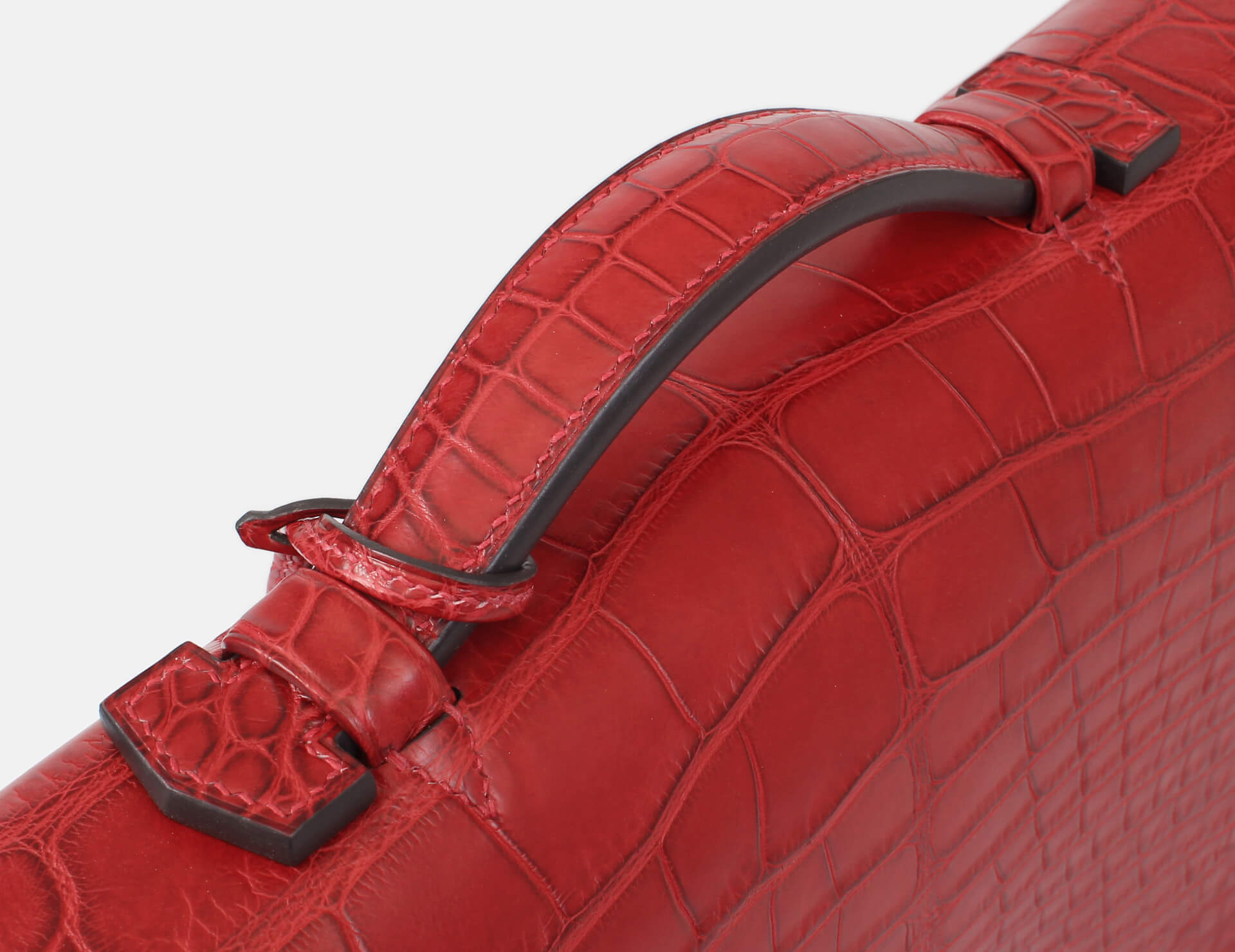 back handle close up of the red alligator hackney briefcase