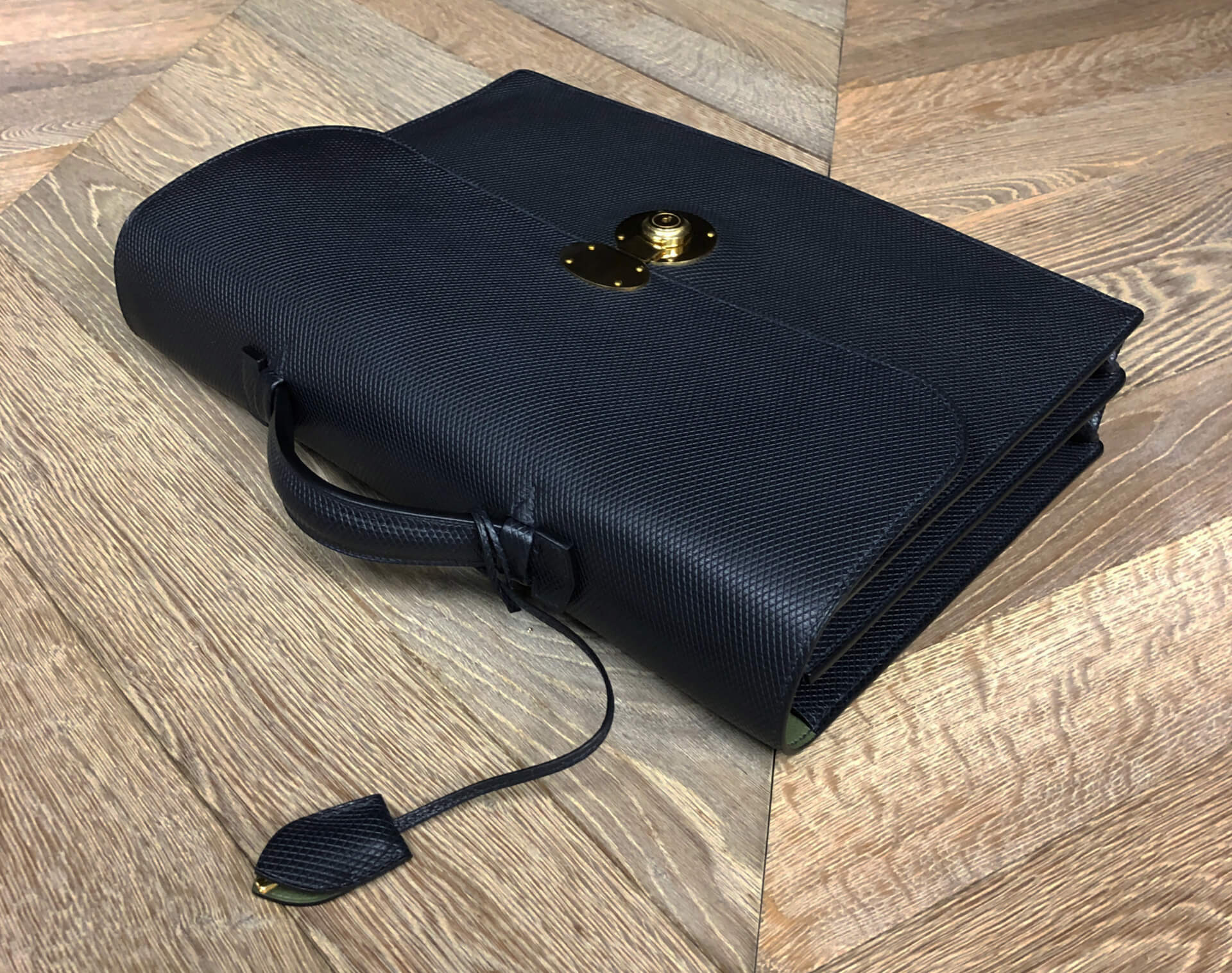 flat surface top view of the black hackney briefcase