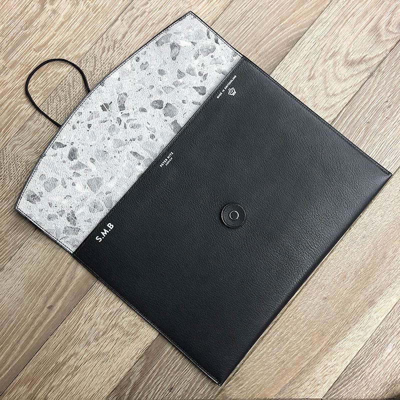 The tether pouch opened with a terrazzo interior