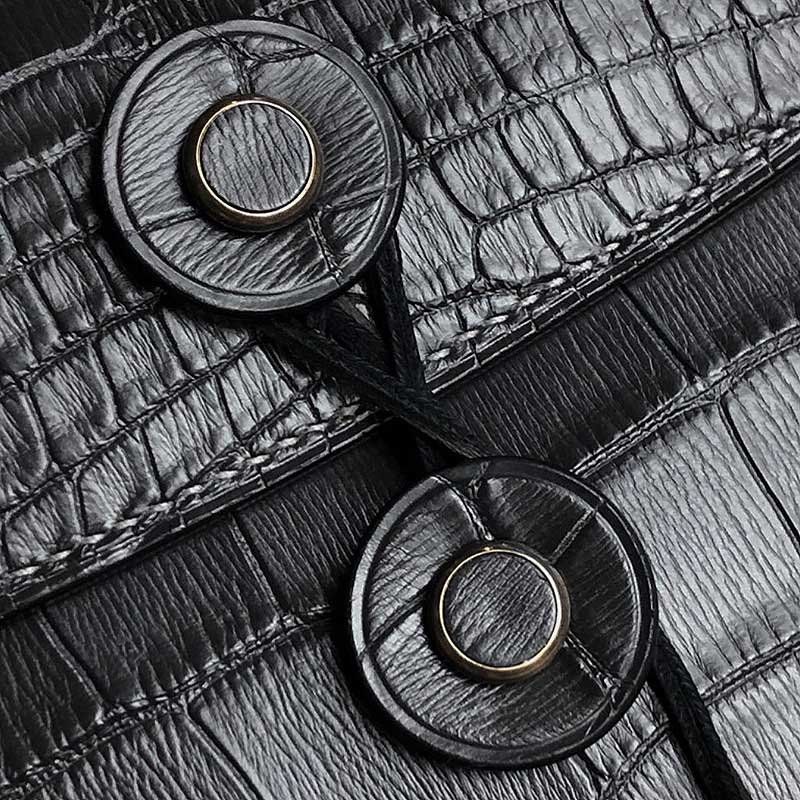 the closing finish of the tether pouch in black crocodile