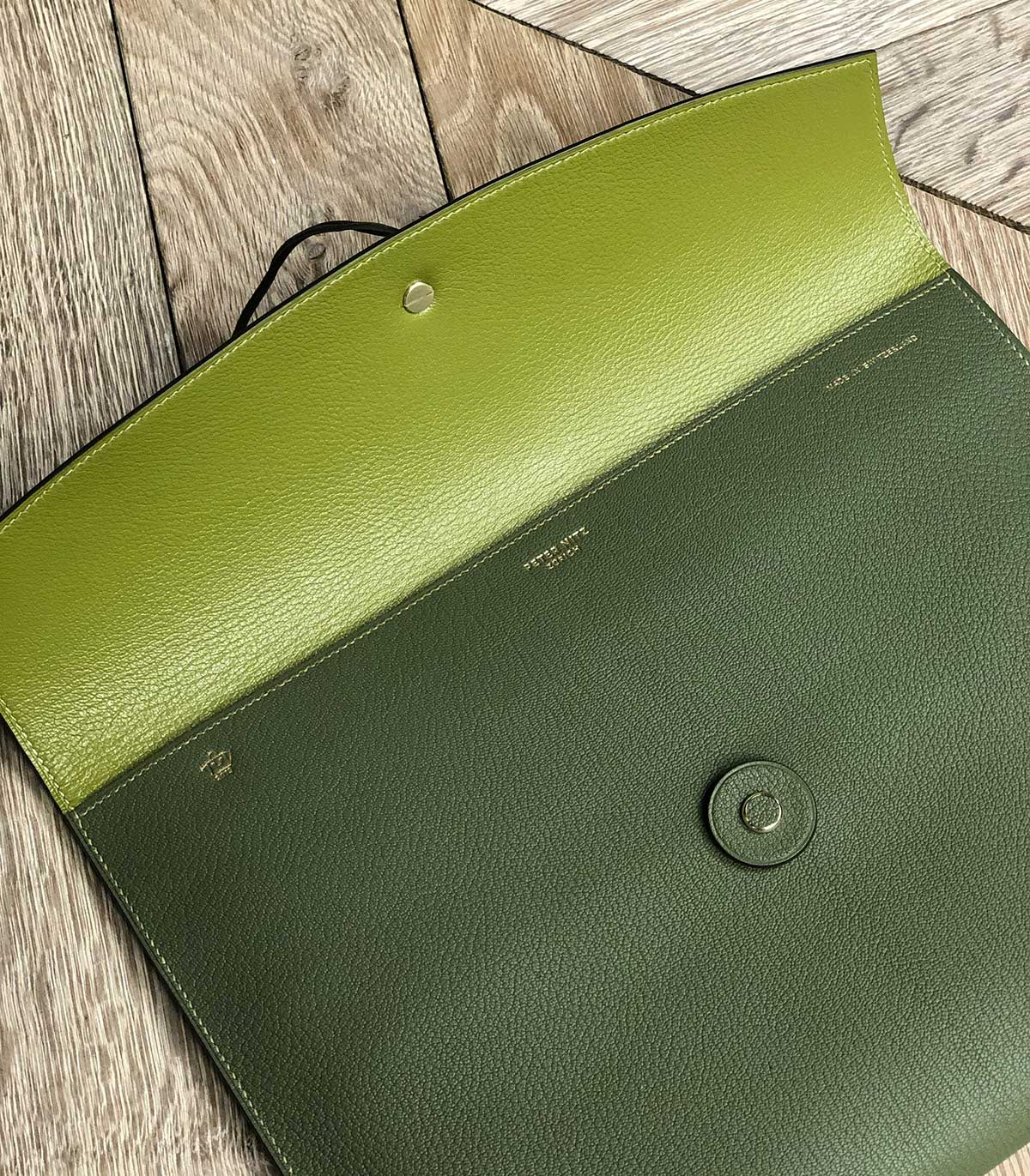 the opening of the tether pouch in green displaying the peter nitz logo