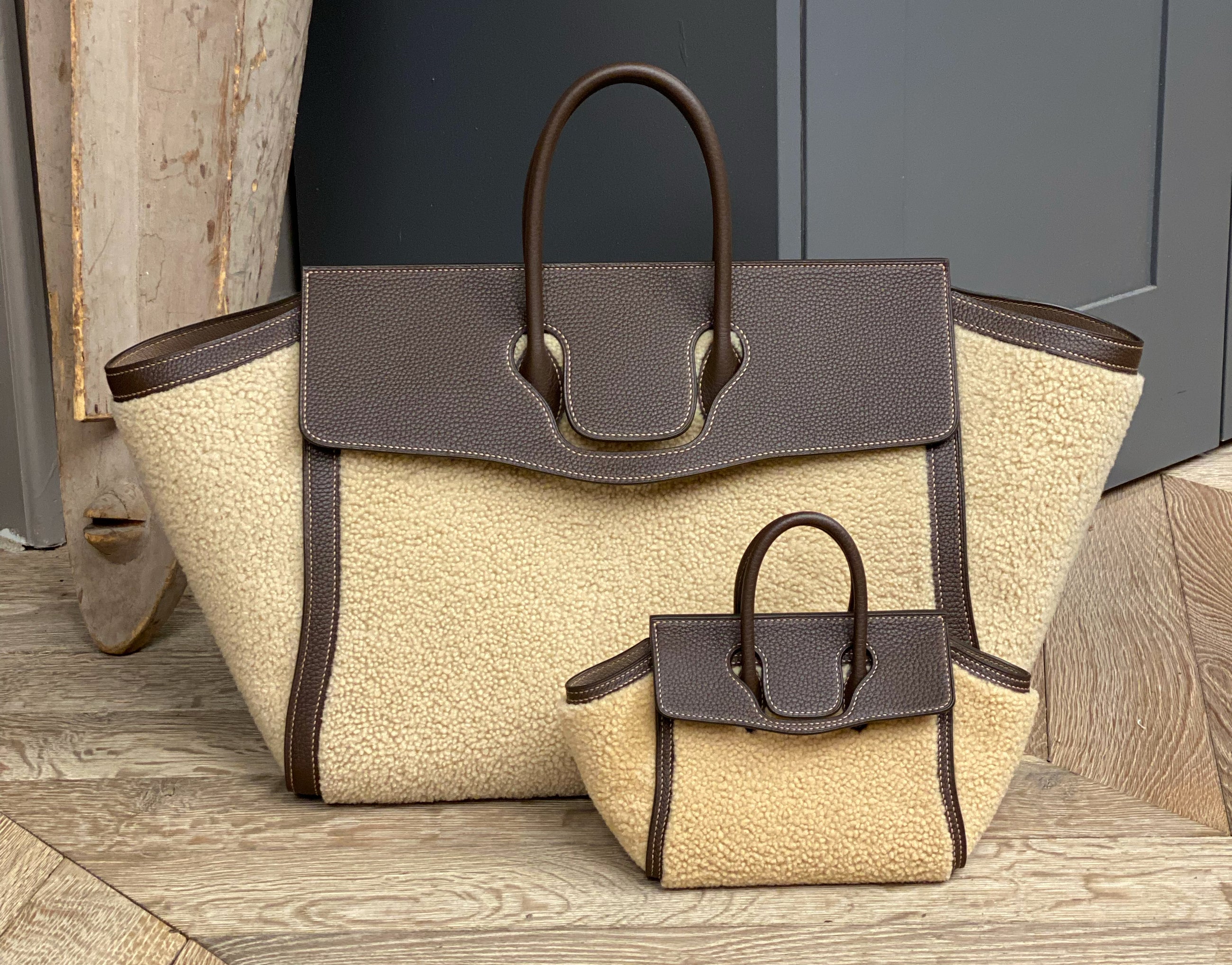 mini dream bag next to a large dream bag in shealing lamb wool material